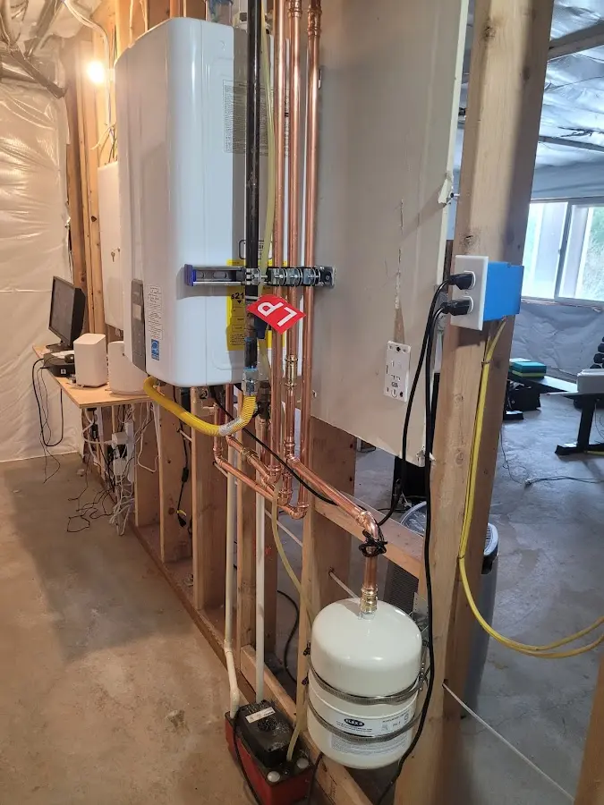 Licensed plumber repairing a kitchen sink in Chartiers